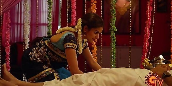 nandhini serial nithya ram hot seducing moves with cleavage show