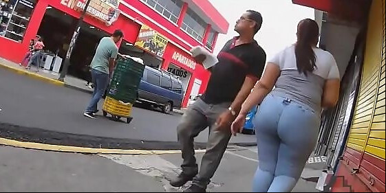 brunette cutie with massive booty ambling down the street